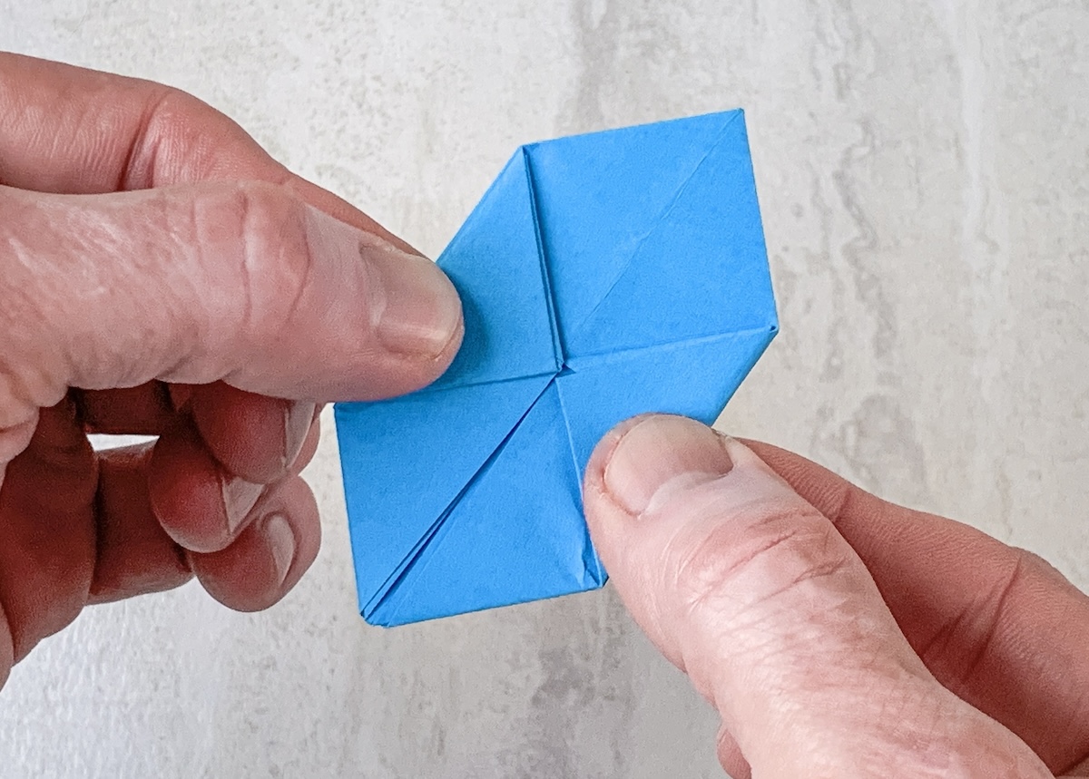 flip over and repeat folding in the tabs